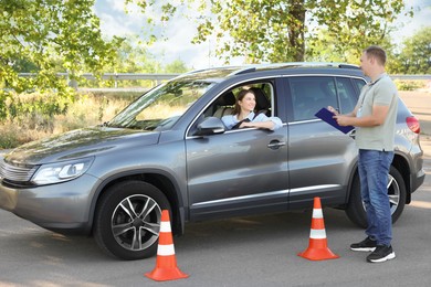 Woman passing maneuverability driving test on track