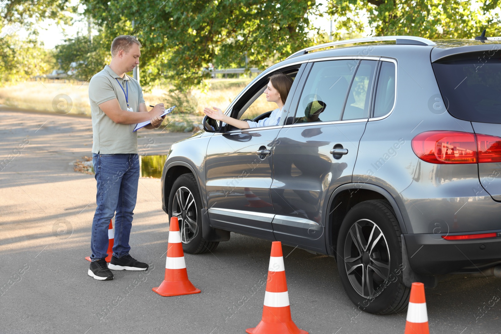 Photo of Woman passing maneuverability driving test on track