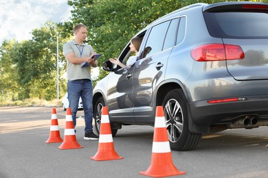 Photo of Woman passing maneuverability driving test on track