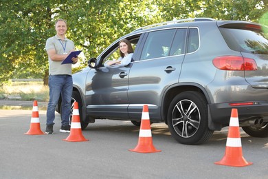 Woman passing maneuverability driving test on track