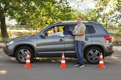 Woman passing maneuverability driving test on track