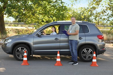 Woman passing maneuverability driving test on track