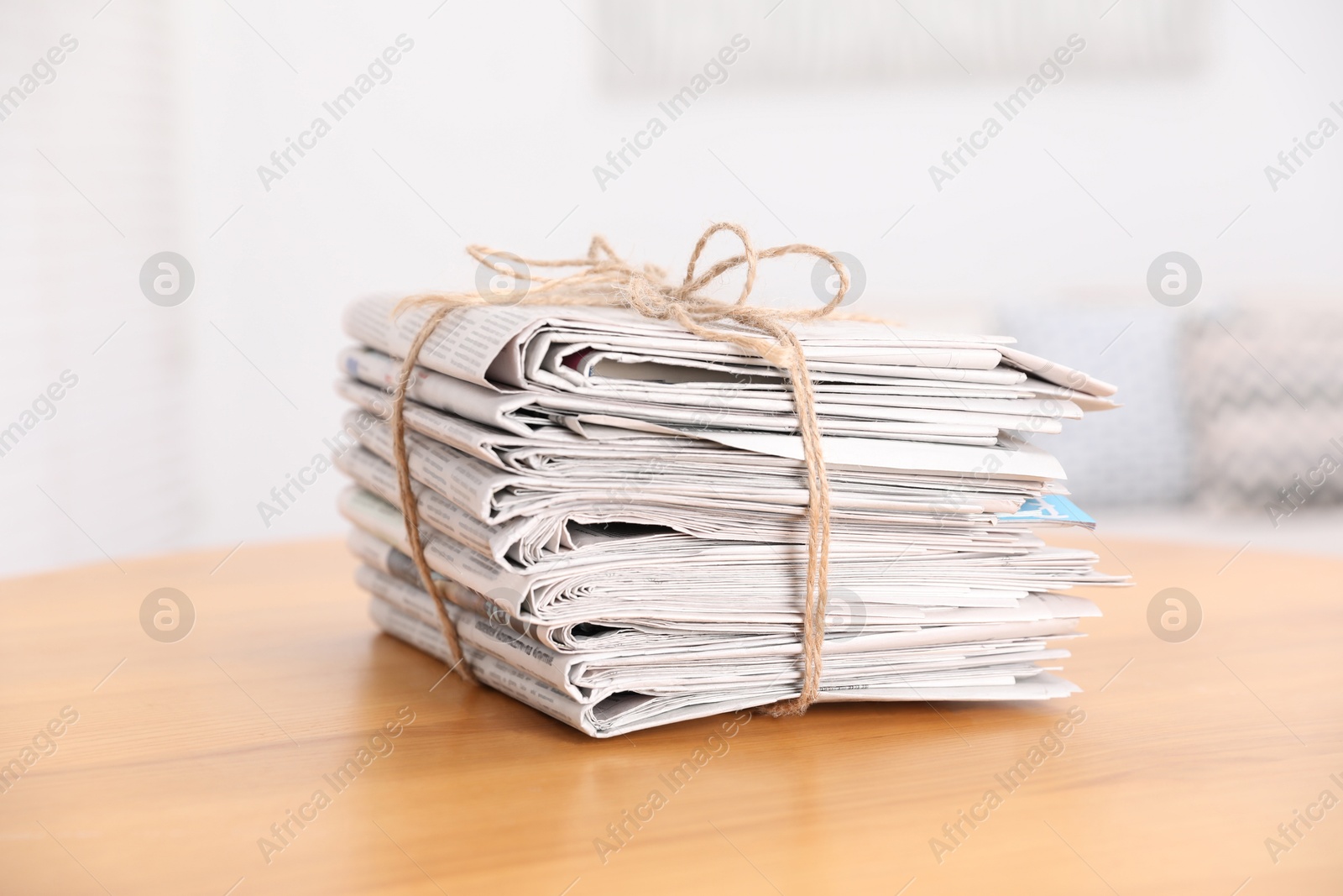 Photo of Stack of many newspapers on wooden table