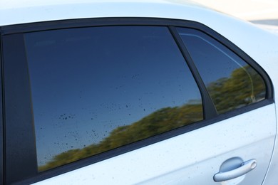 Photo of Modern auto with dirty stains, closeup view