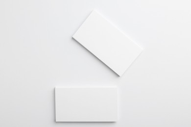 Photo of Blank business cards on light grey background, top view. Mockup for design