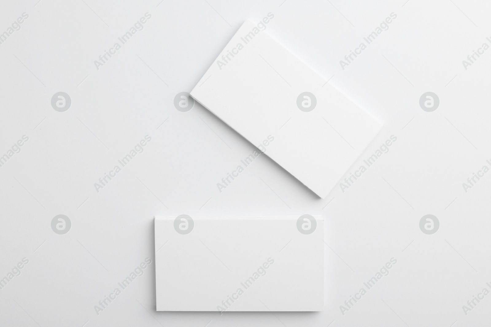 Photo of Blank business cards on light grey background, top view. Mockup for design