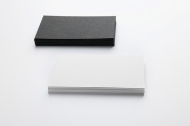 Blank business cards on light grey background. Mockup for design