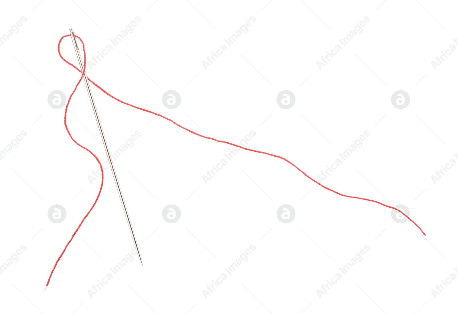 Photo of Sewing needle with red thread isolated on white