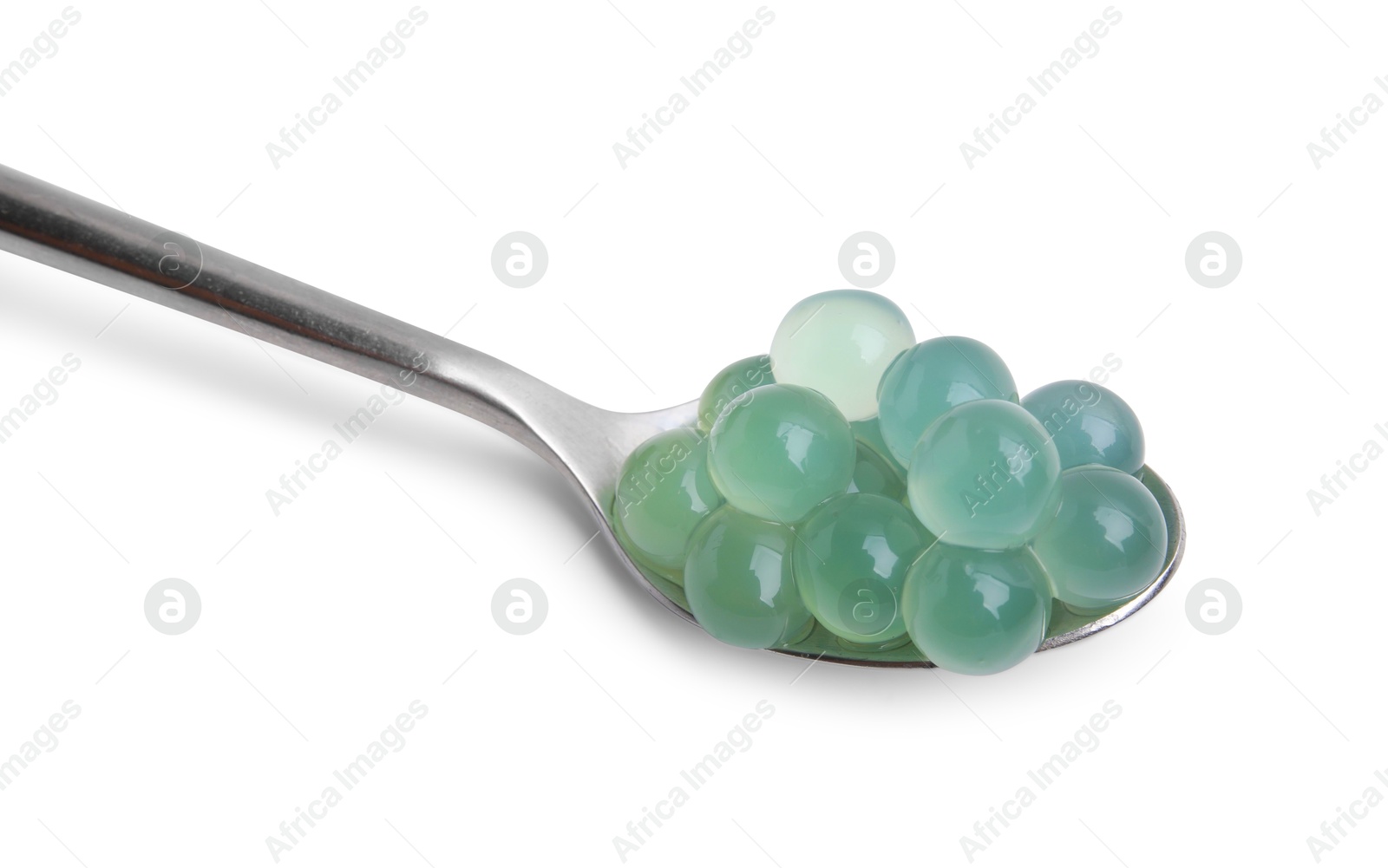 Photo of Bright tapioca pearls in spoon isolated on white