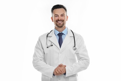 Smiling doctor with stethoscope on white background