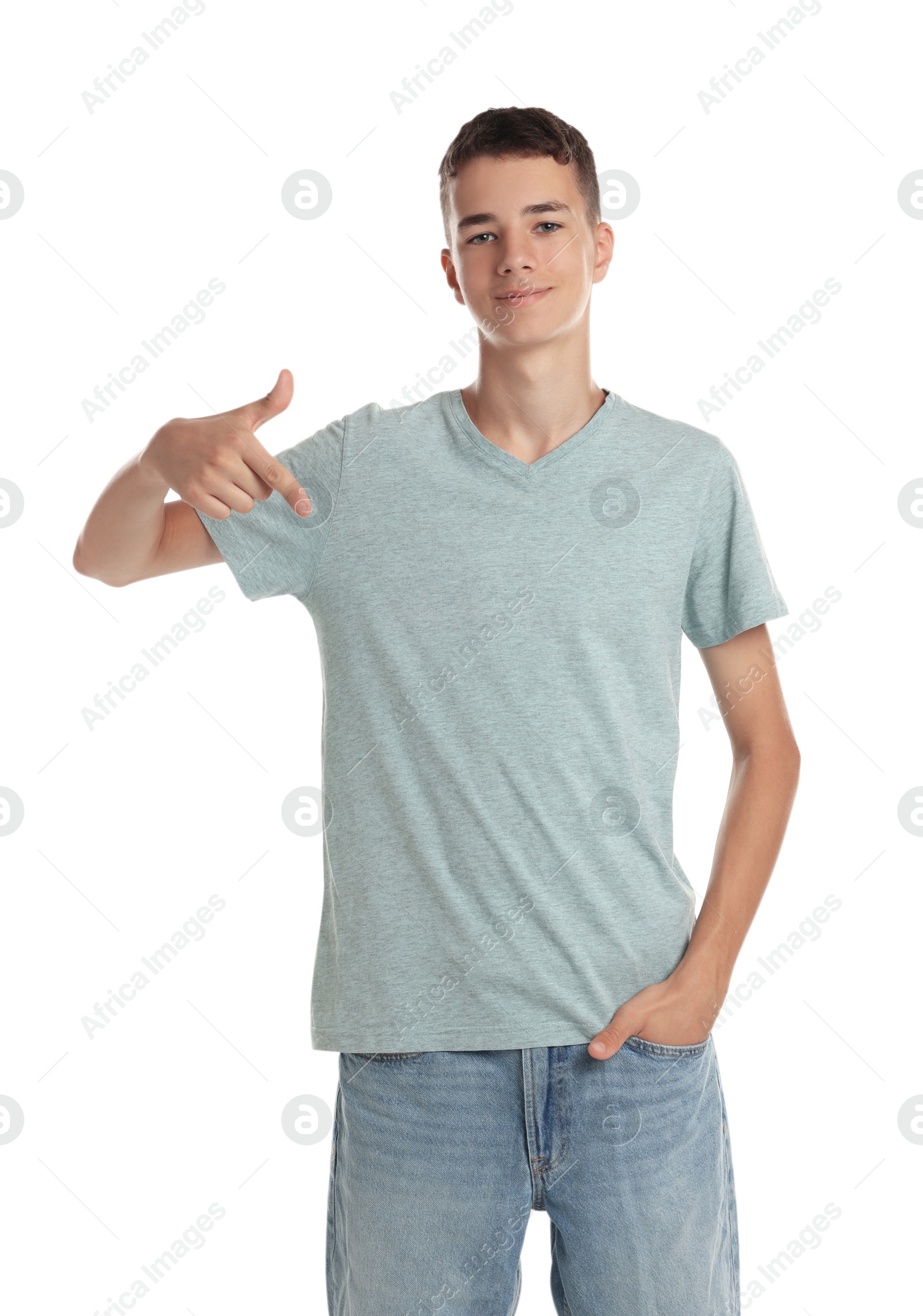 Photo of Teenage boy wearing light grey t-shirt on white background