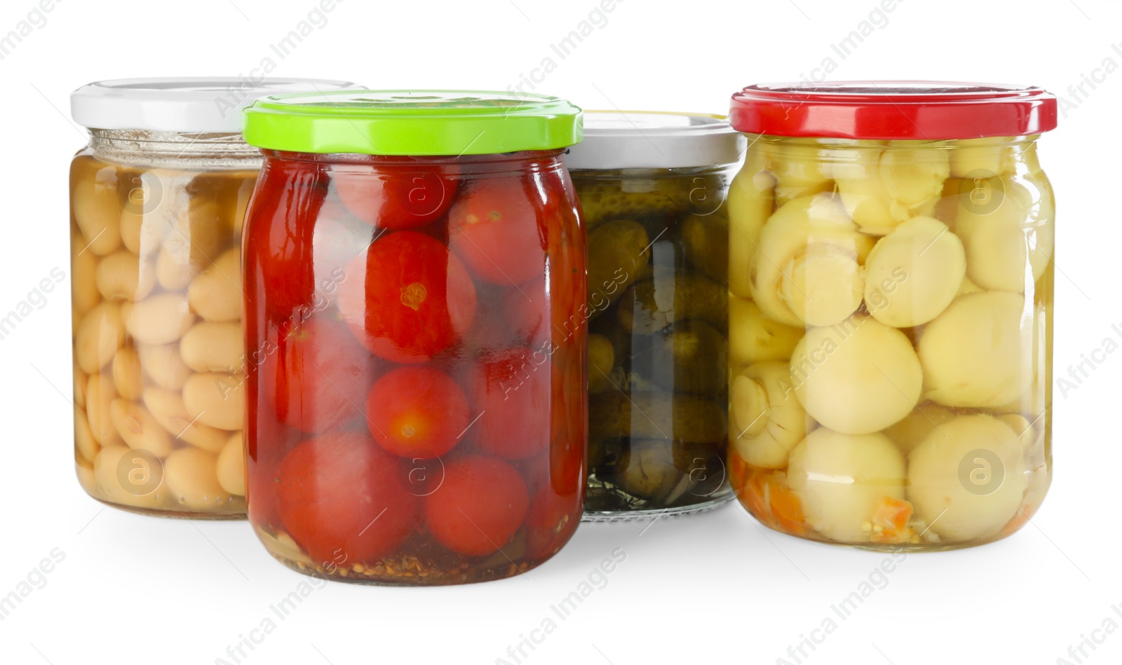 Photo of Different pickled products in jars isolated on white