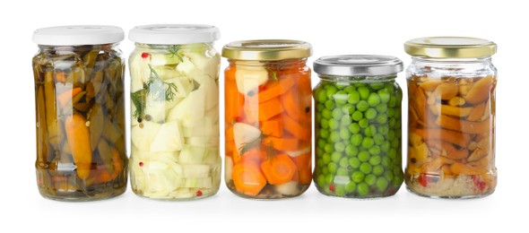 Photo of Different pickled products in jars isolated on white