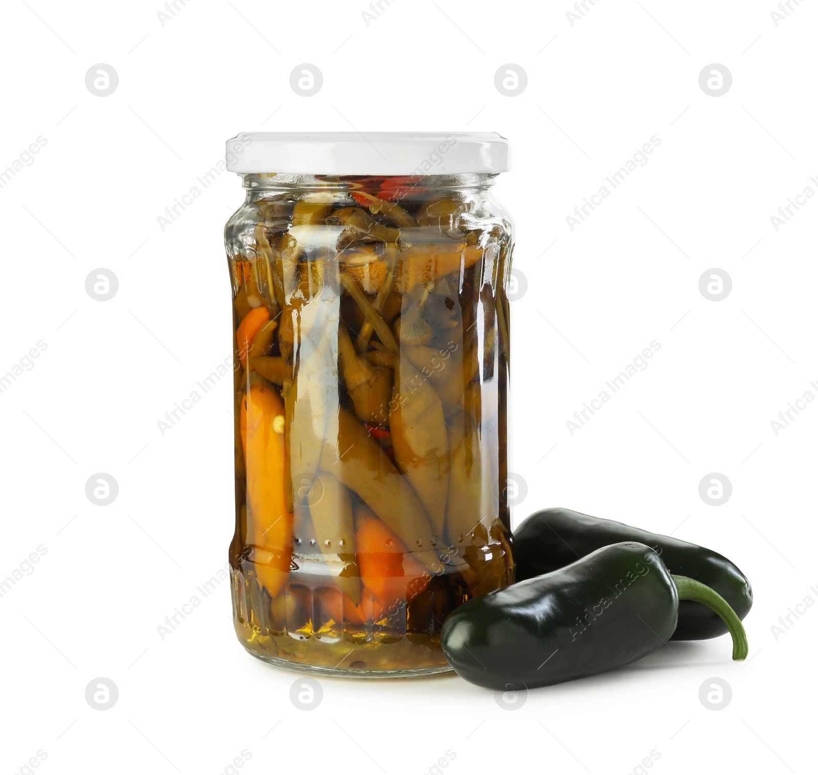 Photo of Tasty pickled jalapeno peppers in jar and fresh vegetables isolated on white