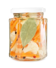 Photo of Tasty pickled carrots and cauliflower in jar isolated on white