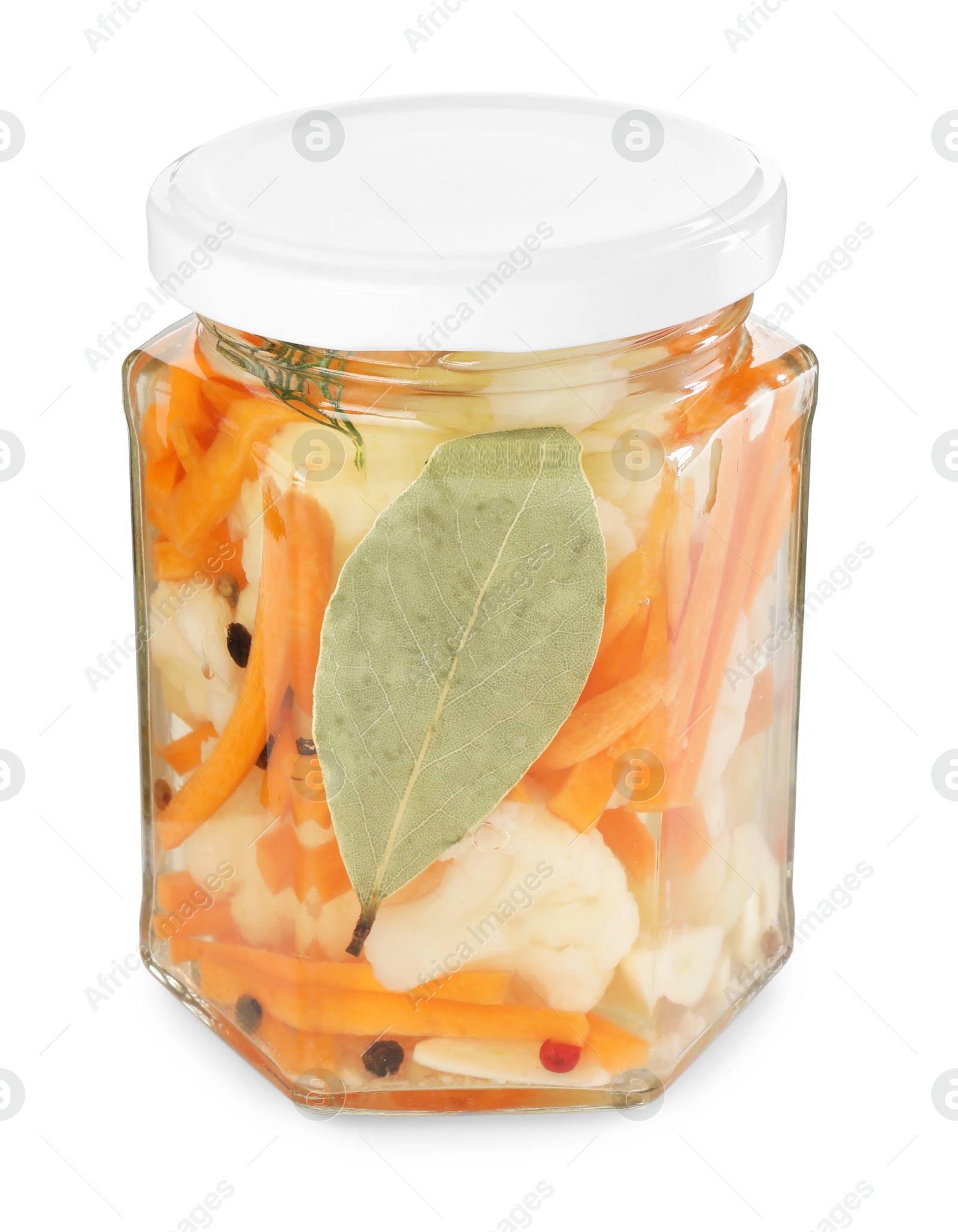 Photo of Tasty pickled carrots and cauliflower in jar isolated on white