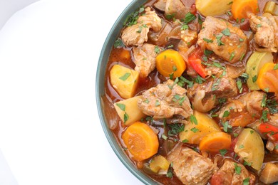 Photo of Delicious stew with vegetables isolated on white, top view