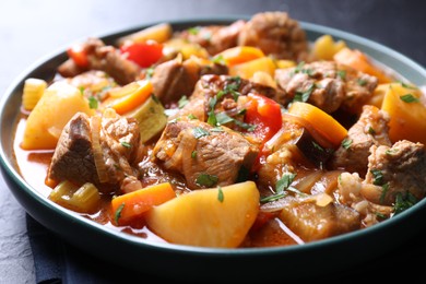 Photo of Delicious stew with vegetables on table, closeup