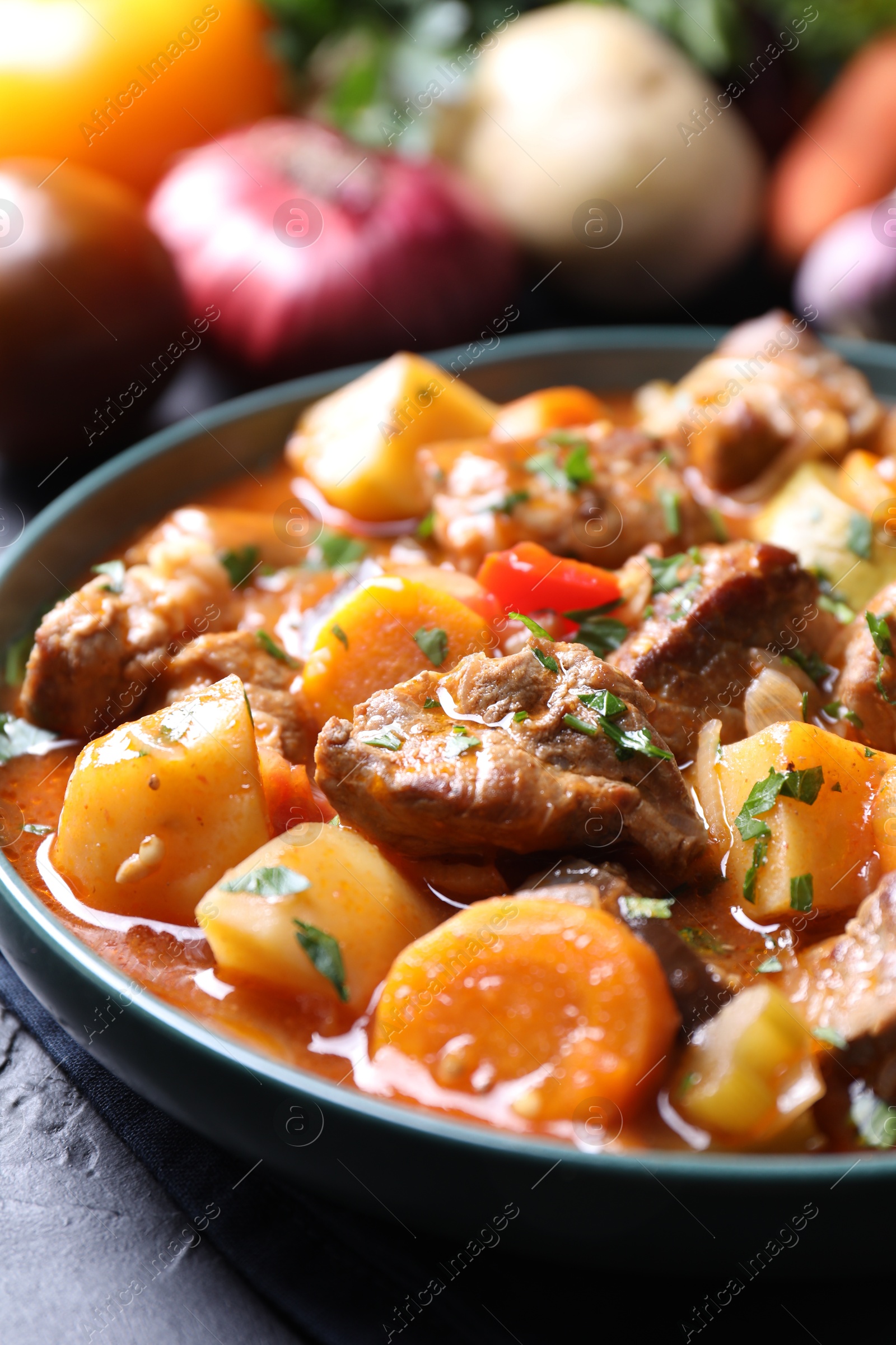 Photo of Delicious stew with vegetables on table, closeup