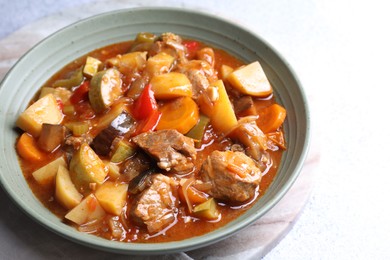 Photo of Delicious stew with vegetables in bowl on table, closeup