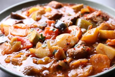 Photo of Delicious stew with vegetables in bowl, closeup