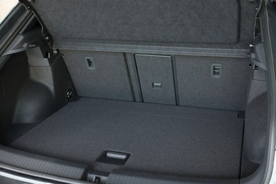 Photo of Grey soft car boot liner mat in trunk of auto