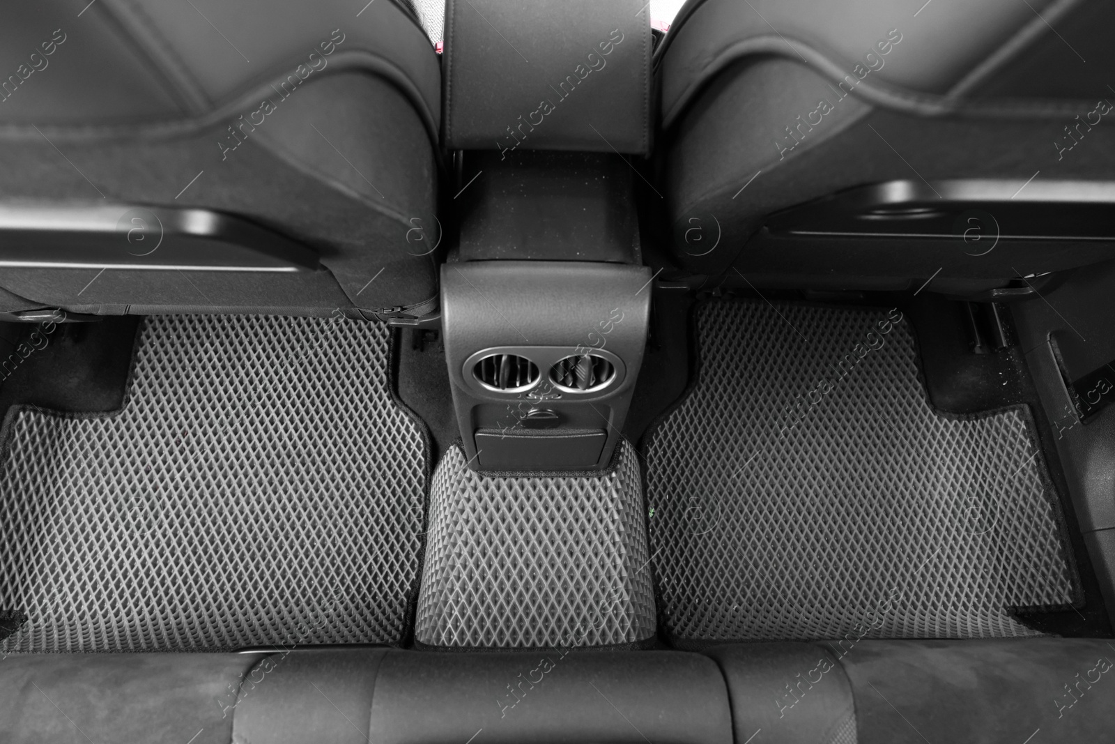 Photo of Grey rubber car floor mats in auto, above view