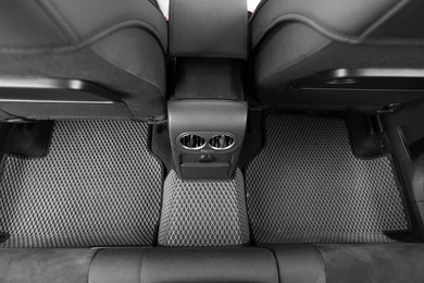 Photo of Grey rubber car floor mats in auto, above view