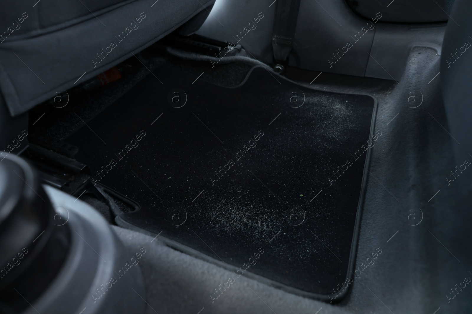 Photo of Black soft car floor mat in auto