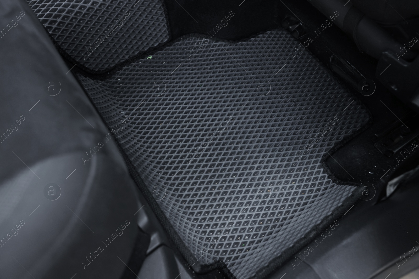 Photo of Grey rubber car floor mat in auto