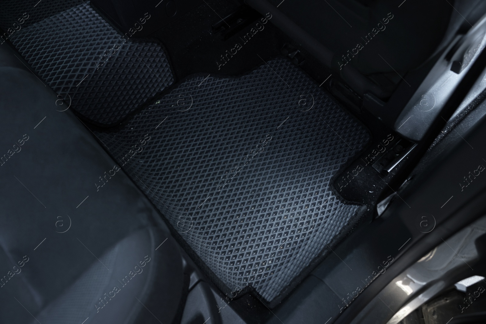 Photo of Grey rubber car floor mat in auto