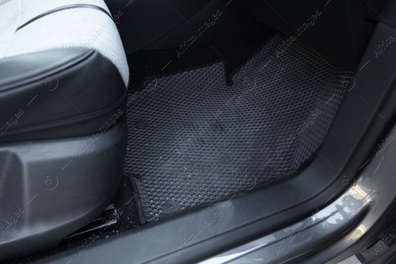 Photo of Grey rubber car floor mat in auto