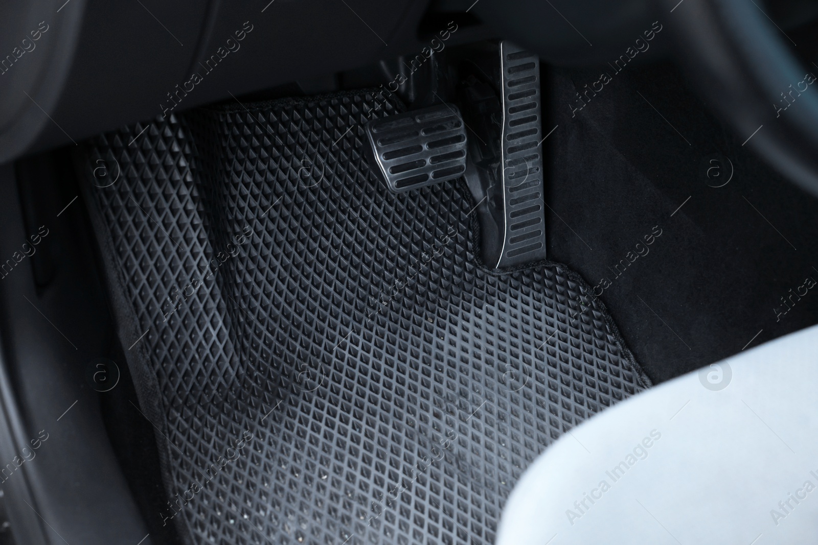 Photo of Dirty grey rubber car mat in auto