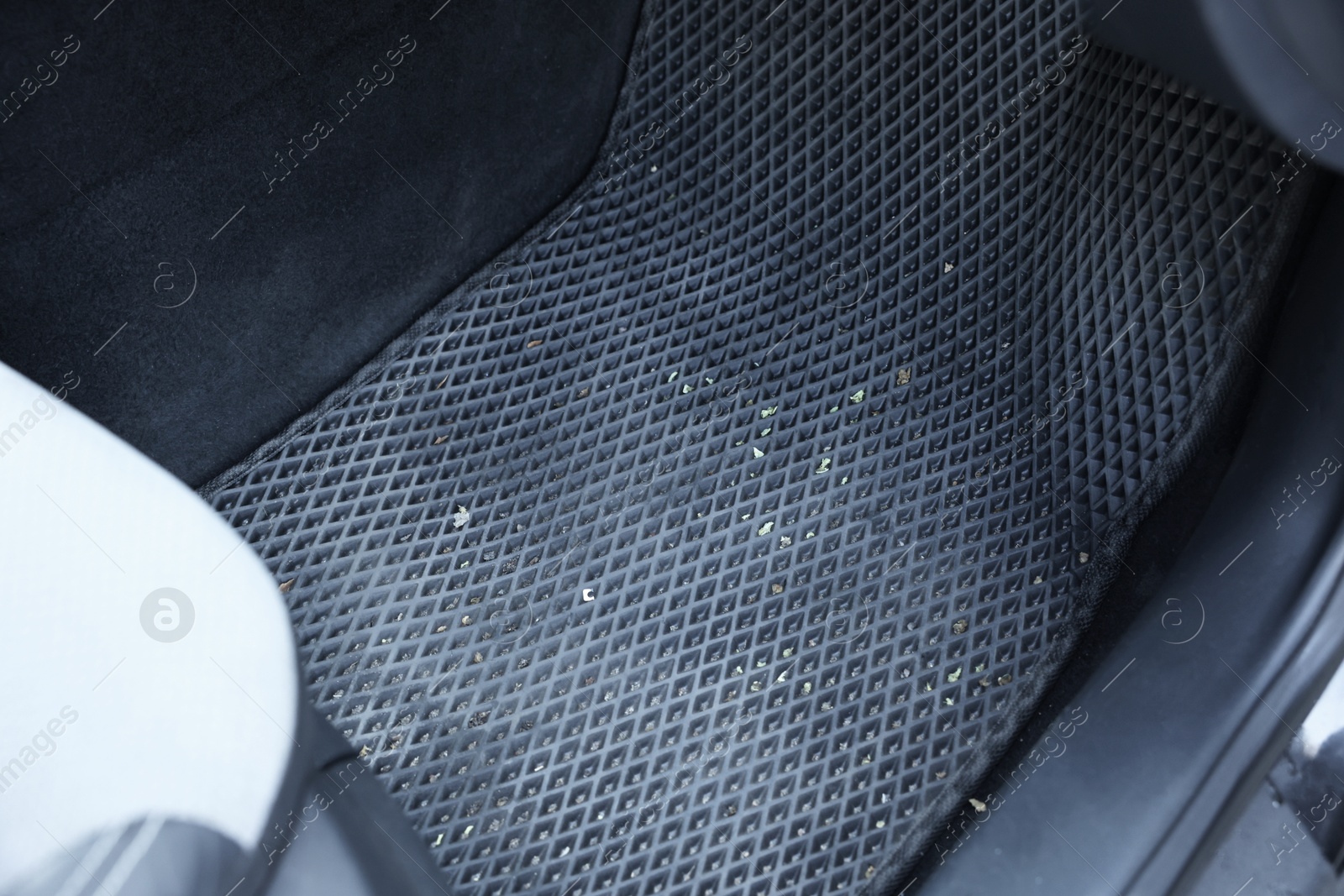 Photo of Grey rubber car floor mat in auto