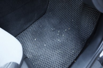 Photo of Grey rubber car floor mat in auto