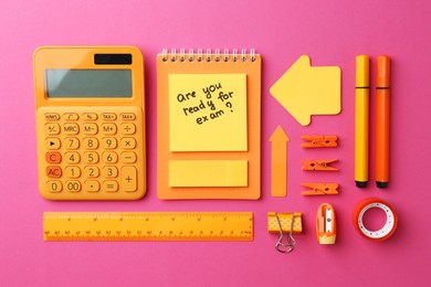 Photo of Paper note with question Are You Ready For Exam and stationery on pink background, flat lay