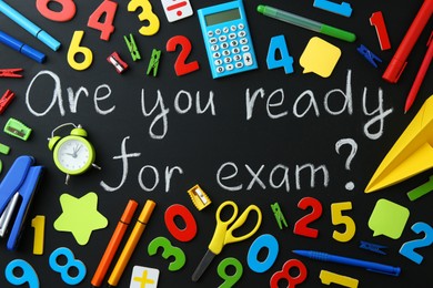 Photo of Chalkboard with question Are You Ready For Exam and stationery, top view