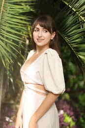 Portrait of smiling woman in tropical forest