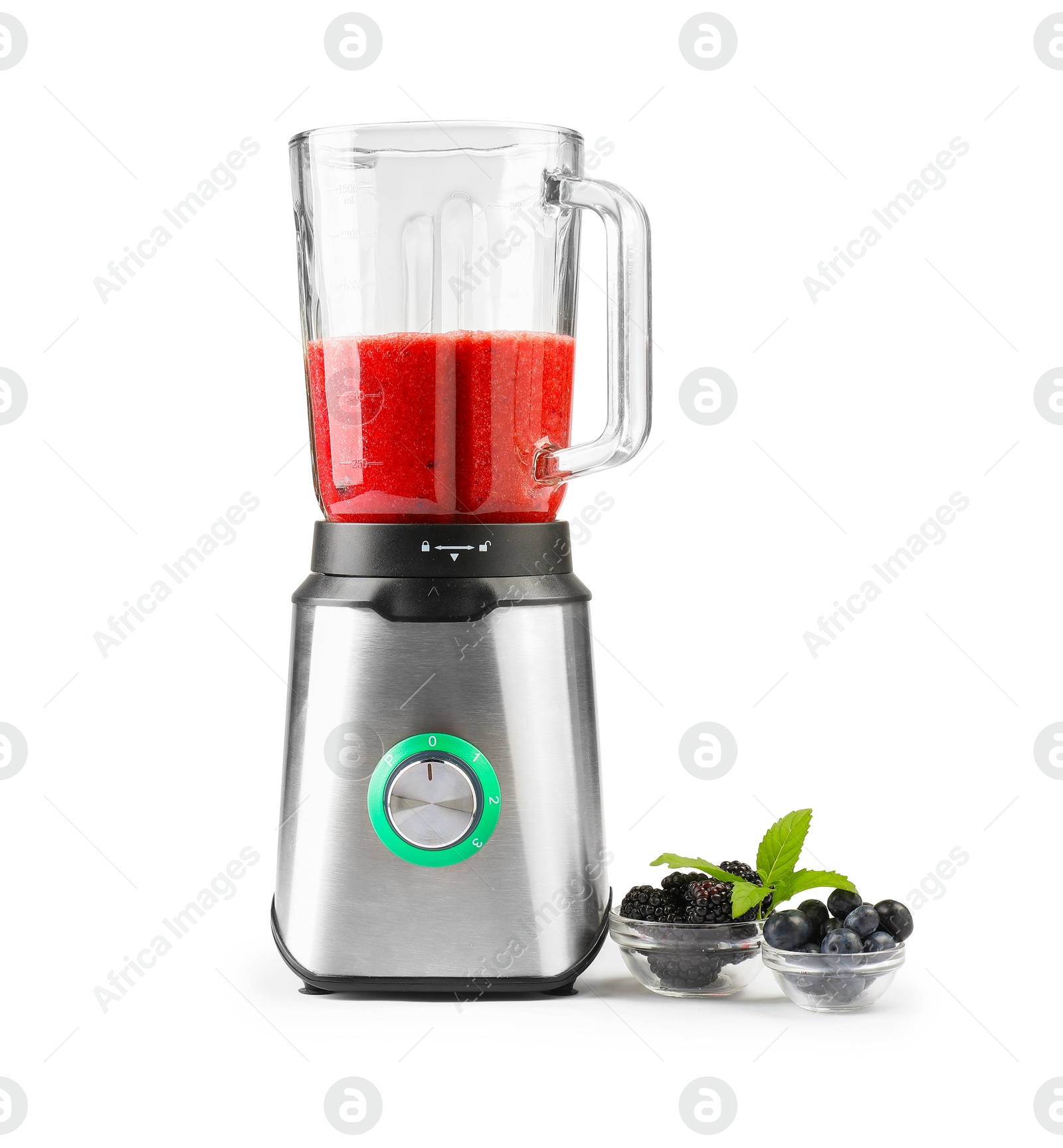 Photo of Blender with mixture of ingredients and fresh berries isolated on white