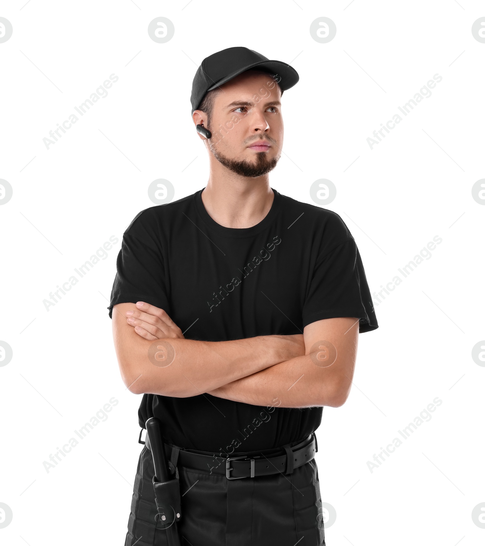 Photo of Young bodyguard with baton and earpiece isolated on white