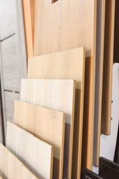 Photo of Many different samples of wooden flooring in store