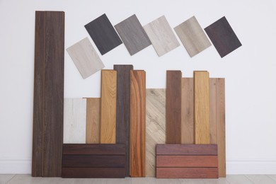 Photo of Many different samples of wooden flooring in store