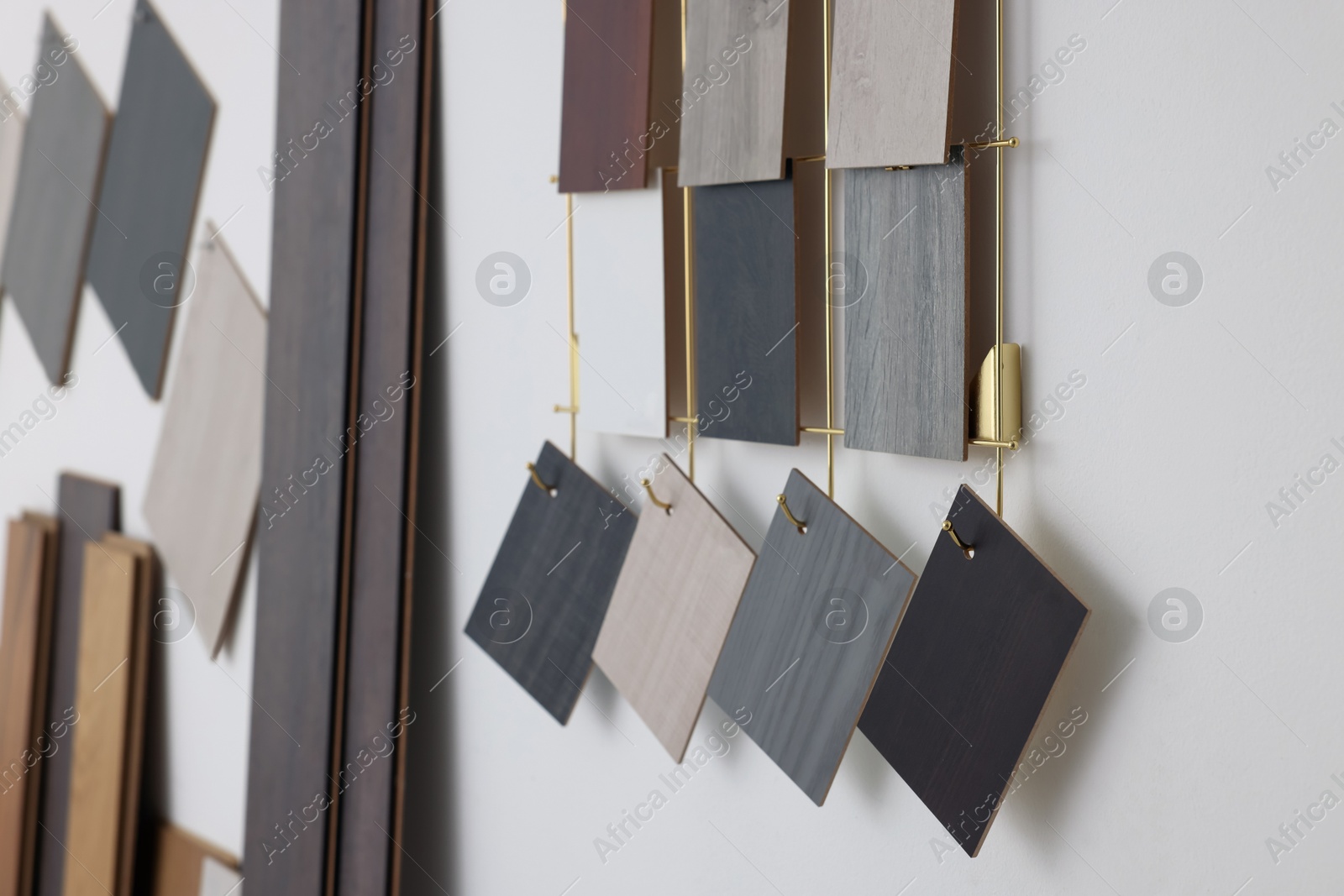 Photo of Many different samples of wooden flooring in store