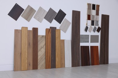 Photo of Many different samples of wooden flooring in store