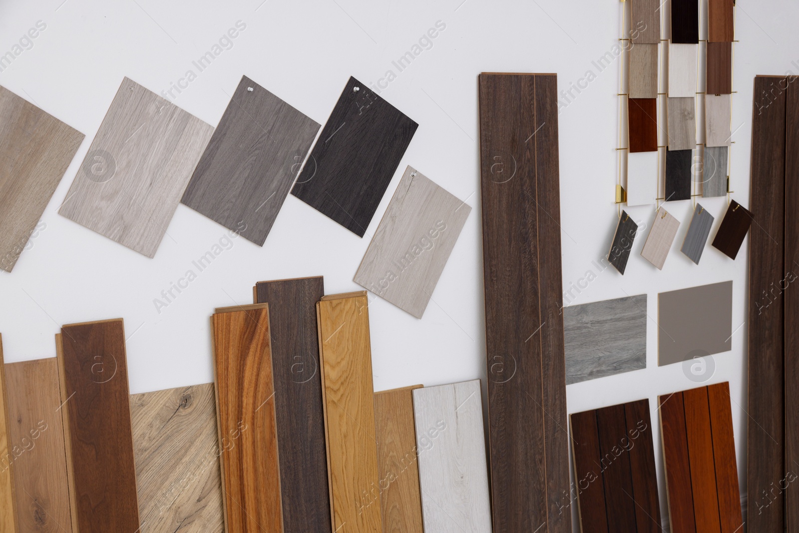 Photo of Many different samples of wooden flooring in store