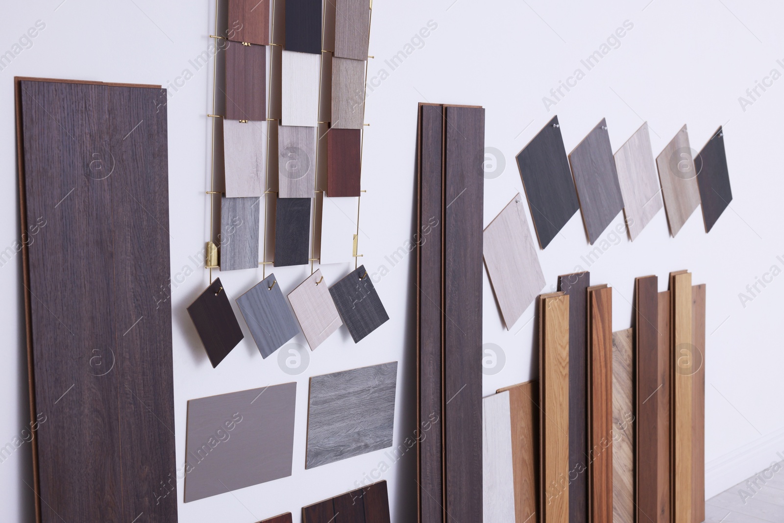 Photo of Many different samples of wooden flooring in store