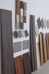 Photo of Many different samples of wooden flooring in store