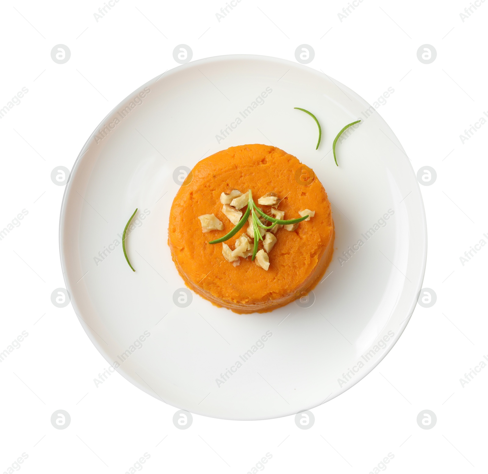 Photo of Plate with tasty mashed sweet potato, rosemary and walnuts isolated on white, top view