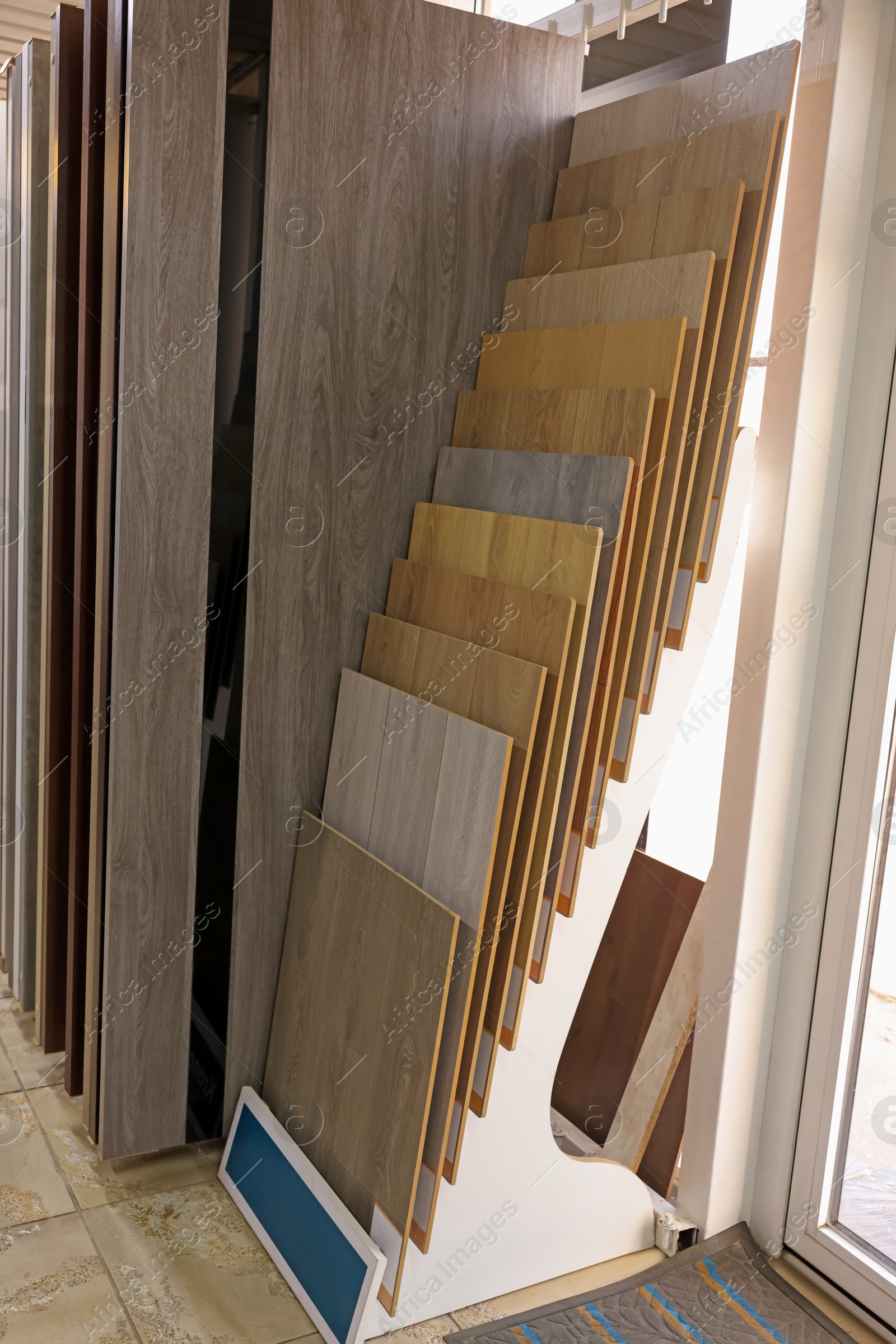 Photo of Many different samples of wooden flooring in store