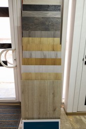 Photo of Many different samples of wooden flooring in store